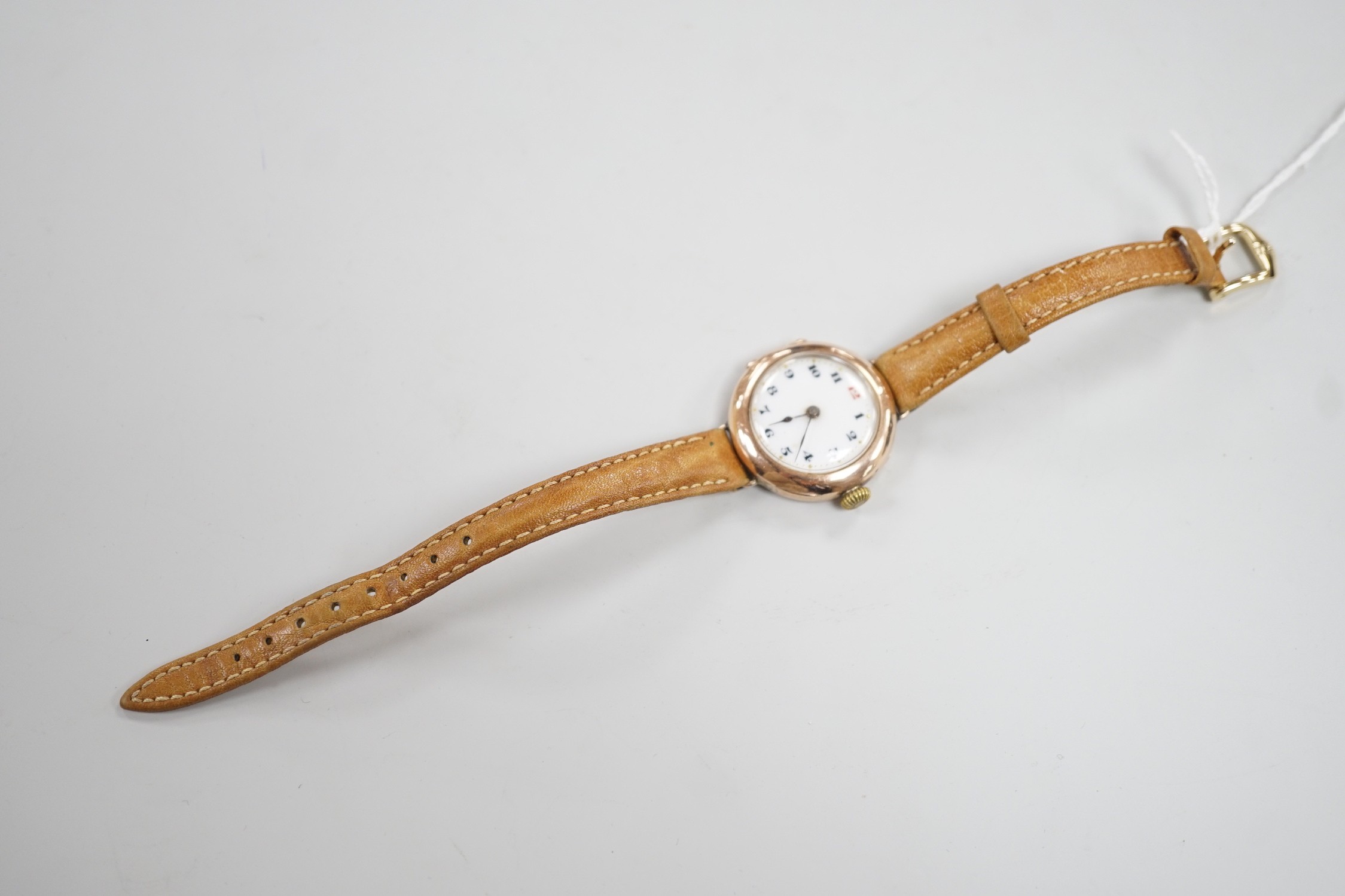 A gentleman's George V 9ct gold Rolex manual wind wrist watch, with Arabic dial, case hallmarked for London, 1915, the case back with engraved initials, on a later associated leather strap, case diameter 28mm.